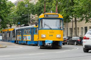 yellow and blue tram on road during daytime